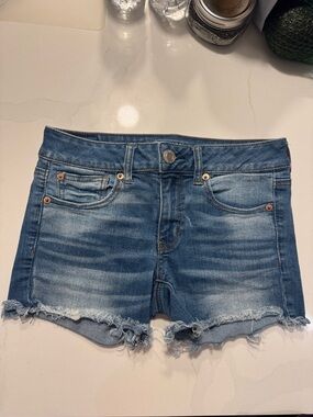 American Eagle Outfitters Mid-Rise Distressed Denim Shorts in Blue